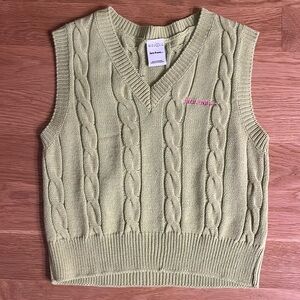 Lime green sweater vest with pink embroidery